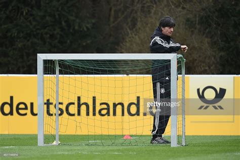 head coach joachim loew looks at his watch during a germany training germany joachim löw