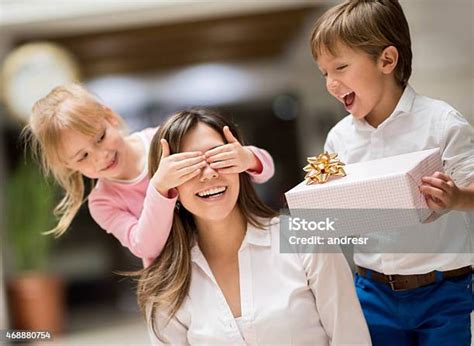 Kids Surprising Mom On Mothers Day Stock Photo Download Image Now