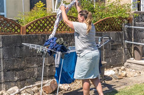 Woman Hanging Washing Out To Dry Stock Photo Download Image Now