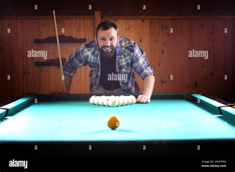 A Man With A Beard Plays A Big Billiard Party In 12 Foot Pool Billiards In The Club Game For