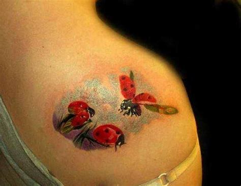 Black tribal and red ladybug tattoo on wrist. ladybug tattoo design on shoulder - Design of ...