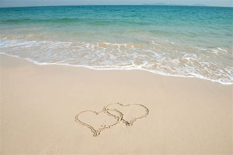 Two Hearts In Sand On A Beautiful Beach Stock Photo Download Image