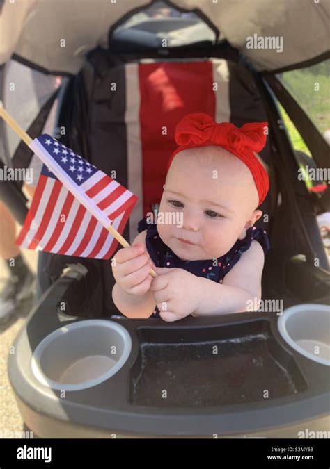 Baby Holding American Flag At 4th Of July Parade Stock Photo Alamy