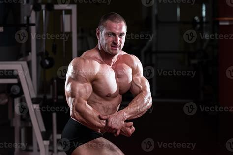 Muscular Man Flexing Muscles 820113 Stock Photo At Vecteezy
