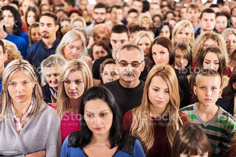 Large Group Of Serious People Standing Together Stock Photo & More ...