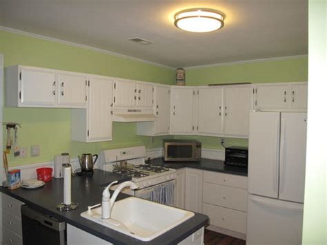 Use a nail gun to nail through the boards into the cabinets and ceiling. Upper cabinets - to ceiling in small kitchen?