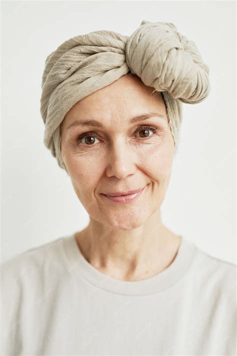 Premium Photo Minimal Close Up Portrait Of Beautiful Mature Woman Wearing Headscarf And