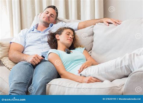 Couple Relaxing On Sofa Stock Image Image Of Home Lying 37820199