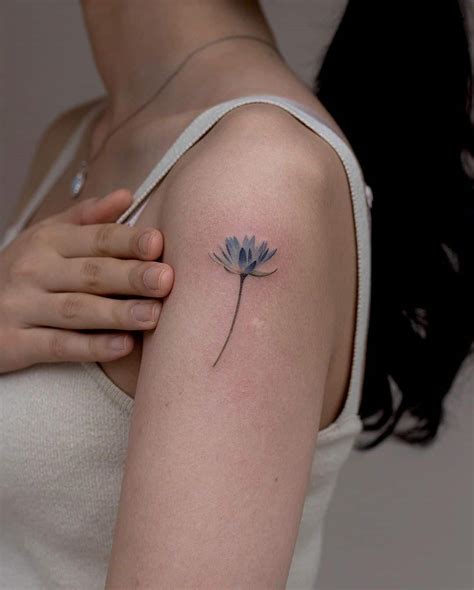 July Birth Flower Tattoos Water Lily Tattoo And Delphinium Howlifestyles