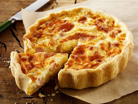Quiche Lorraine Filled With Bacon Cheese And Topped With A Tomato