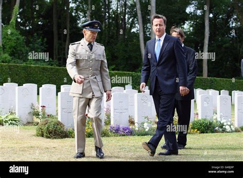 Prime Minister David Cameron Tours Tourgeville Military Cemetery