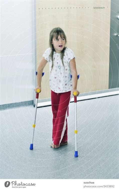 Little Girl On Crutches In Hospital A Royalty Free Stock Photo From