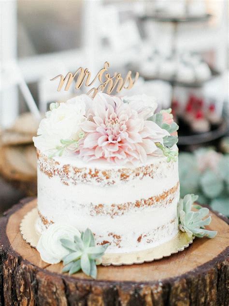 Final wedding cake, decorated with roses and monogram. Single-Tier Wedding Cakes