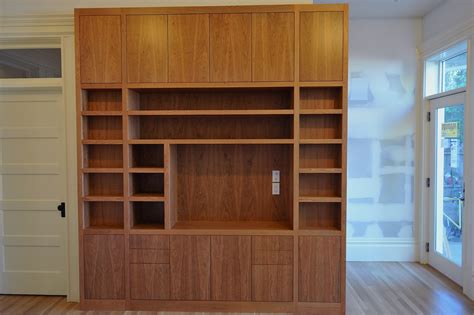 Cabinetry is expensive, so no need. Clayton Woodworks: An Economy of Space