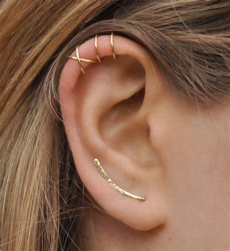 See full list on wikihow.com Picture Of a lobe piercing with a long earring and stacked ...