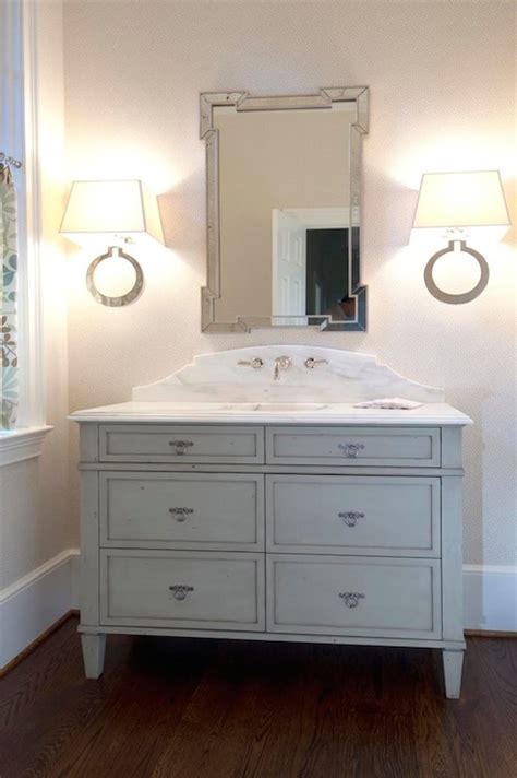 Carrara marble backsplash and countertop look exquisite in a bathroom. Curved Marble Backsplash Design Ideas