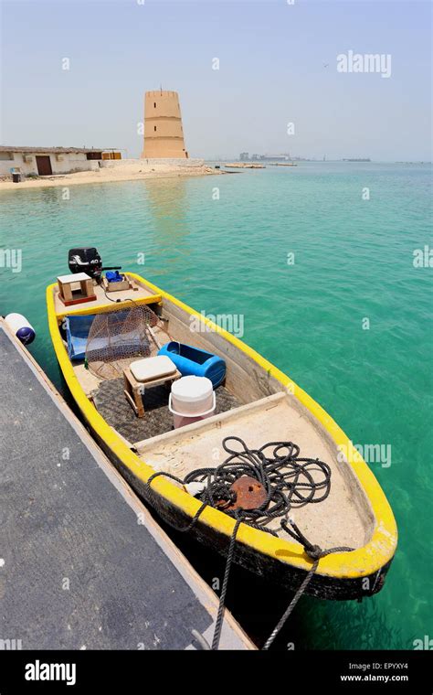 View Of The Turret At The Al Dar Beach Resort With A Fishing Boat In