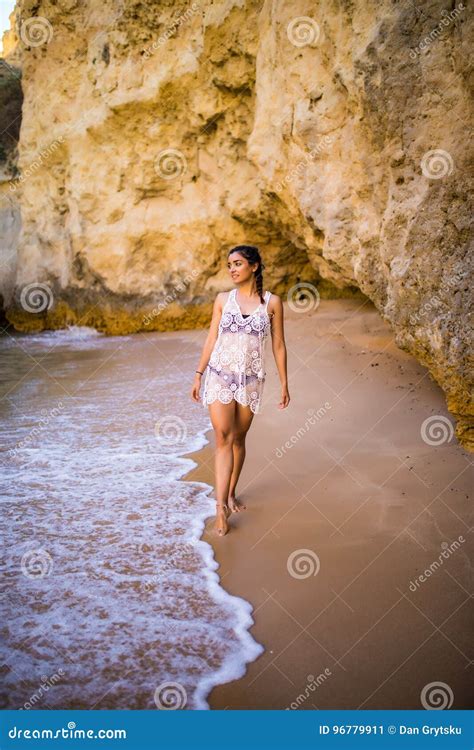 beutiful latin mexican girl tourist walking on beach with rocks stock image image of female