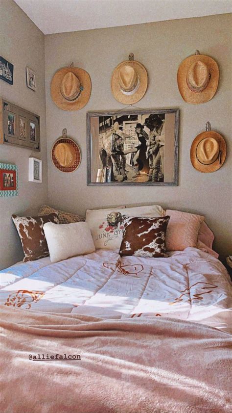 A Bed In A Bedroom With Hats On The Wall Above It And Pictures Hanging