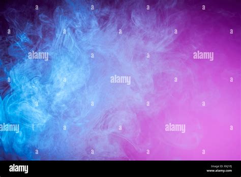 Colorful Blue Smoke On A Pink Isolated Background Background From The