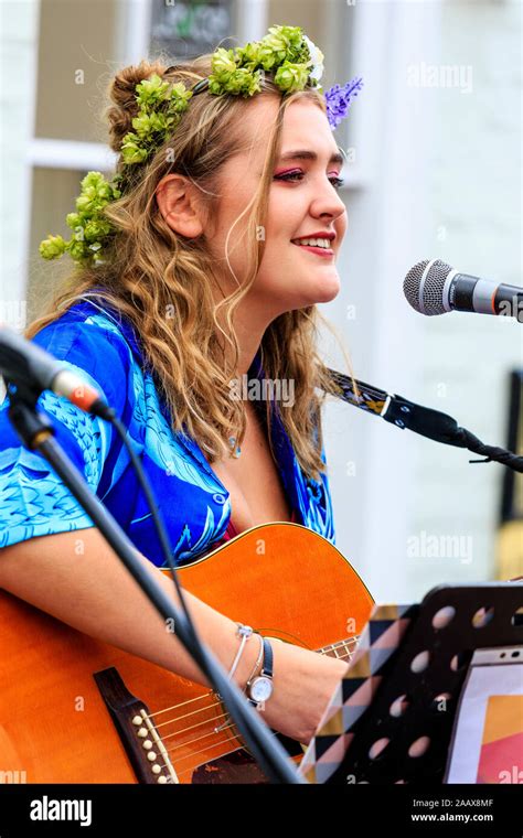 Maisy Beth Young Blonde Folk Singer Singing While Playing Acoustic