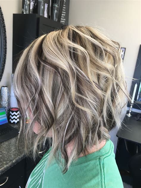blended and chunky hilights and lowlights with angled long bob hair styles hair color