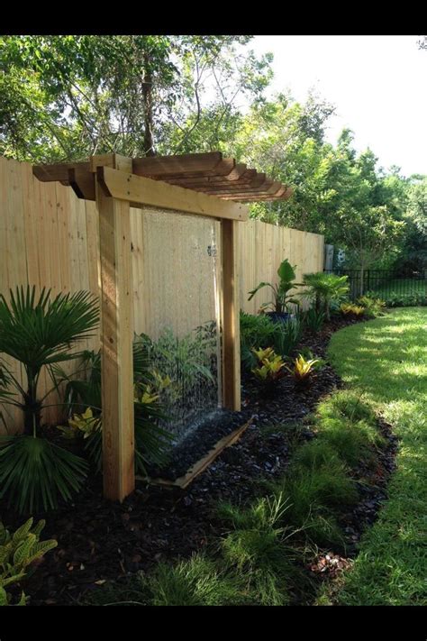 How to hang pergola lights. Custom built pergola with a rain curtain water feature ...