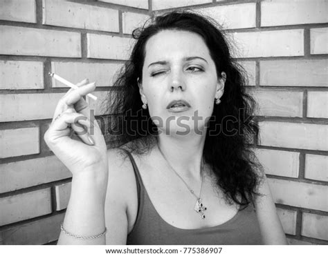 Mature Beautiful Brunette Woman Smoking Cigarette Stock Photo 775386907