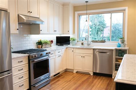Explore ge appliances' stainless steel design center. Simple white cabinets with stainless steel Kitchen Aid gas ...