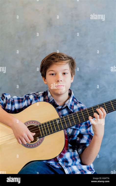Teenage Boy Holding Guitar Hi Res Stock Photography And Images Alamy