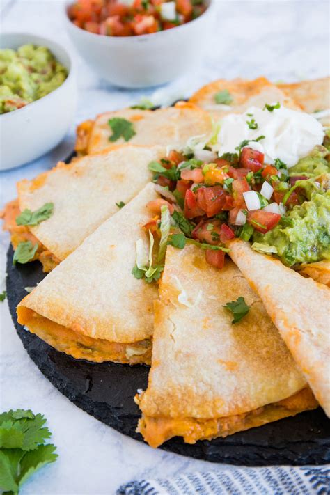These easy chicken quesadillas are loaded with mexican cheese, hatch chilies, and juicy rotisserie chicken. Creamy Chicken Quesadillas Recipe | Wanderzest