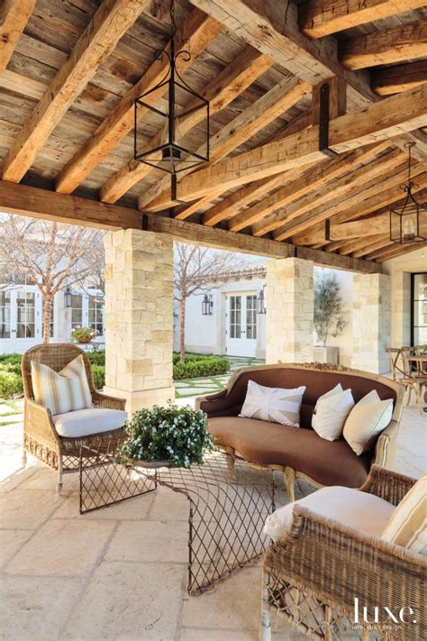 The furniture collection is designed for the outdoors but can also be used in large indoor spaces. Traditional Neutral Covered Outdoor Dining Room with ...