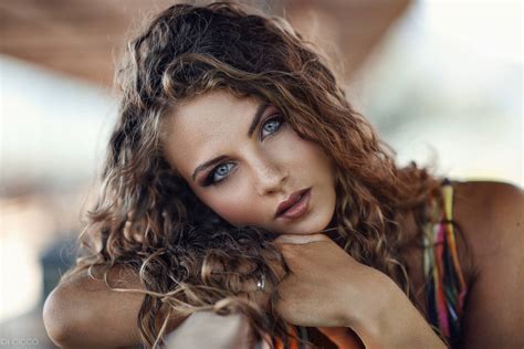 Download Tanned Woman With Curly Hair Wallpaper Wallpapers Com
