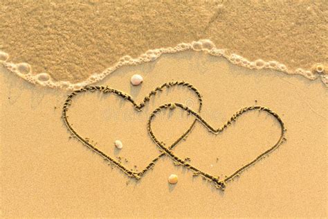 Two Hearts Drawn On The Sand Of A Beach Love Stock Photo Image Of