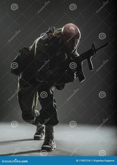 Soldier Man Hold Machine Gun On A Dark Background Stock Photo Image
