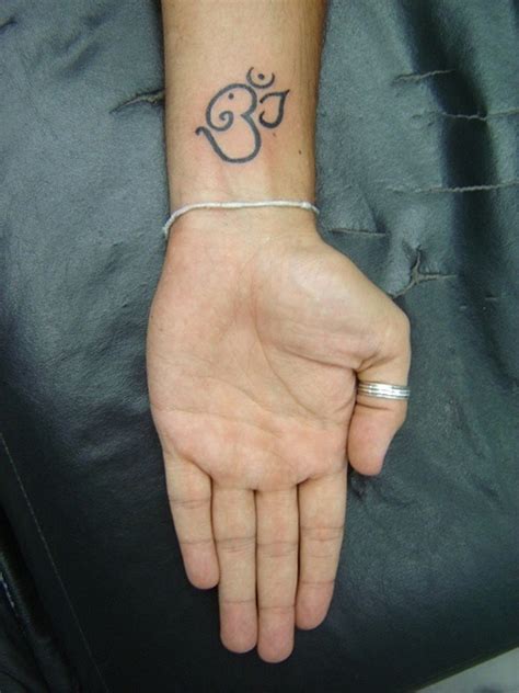 Elephant wrist tattoo designs, ideas and meaning. 46 Om Tattoo On Wrists
