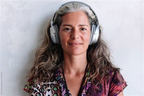 Smiling Grey Hair Woman Are Listening Music By Stocksy Contributor Viktor Solomin Stocksy