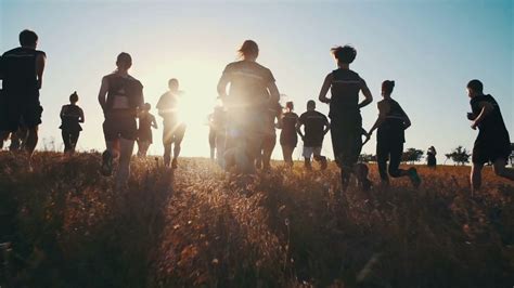 Group Of People Running On Field In Sunset Stock Footage Sbv 304654697