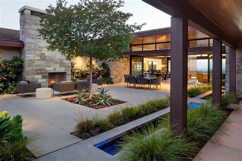 Santaluz Ranch Home Courtyard With Outdoor Dining And Fireplace