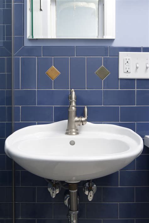 The uniformity of subway tile wall panels creates a clean geometric backdrop that is perfect for use in a contemporary bathroom. Blueberry Subway Nirvana Bathroom, Tile Floor and Walls