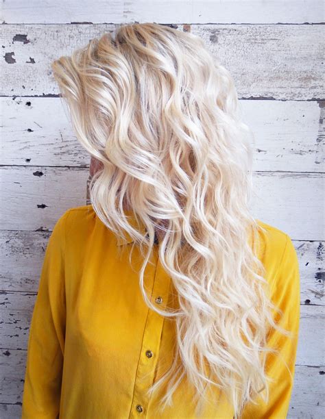 Blonde hair isn't a trend, but the tones and shades definitely change each season. Bleach blonde mermaid waves … | Hair styles, Platinum ...