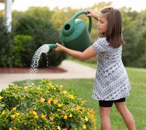 Girl Watering Plant Helpful Parenting Tips