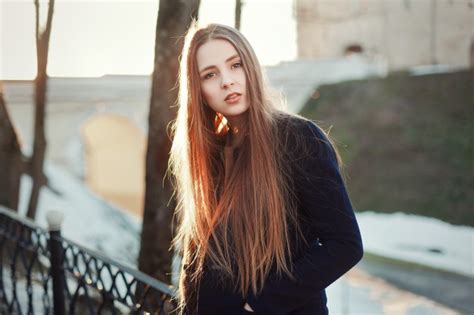 Worried Young Woman With Long Hair Outdoors Photo Free