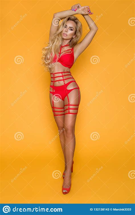 Blonde Model In Red Lingerie On A Yellow Background Stock Image Image Of Face Gorgeous 132138143