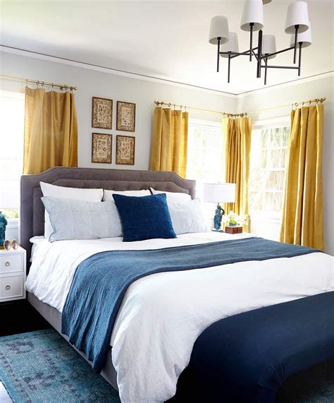 The bedding matches attractively with the overall look of the decor. Master bedroom makeover - Emily Henderson | Blue and gold ...