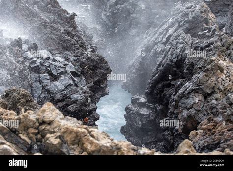 The Ocean Wave Crashing Into The Rocks And Splashing Stock Photo Alamy