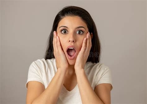 Young Attractive Woman With A Surprised And Shocked Face Eyes And Mouth Wide Open Stock Image
