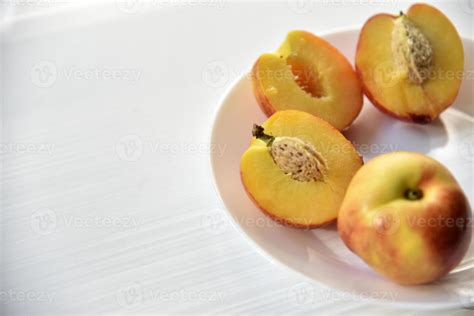 Sliced Peaches And Nectarines On A White Plate 8569292 Stock Photo At