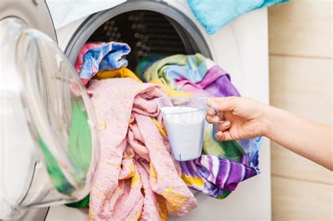 Person Putting Clothes Into Washing Machine Stock Photo Image Of
