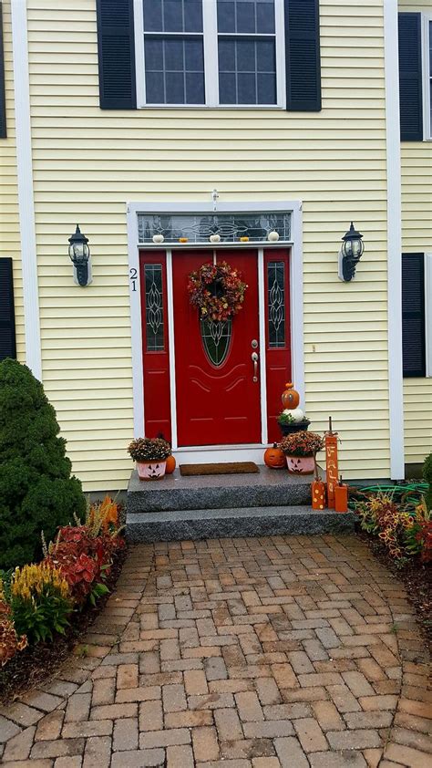 The front door is your opportunity to make a great first impression, so it's important not to treat it as an afterthought, or worse, forget it altogether. Heritage red front door yellow house benjamin moore ...